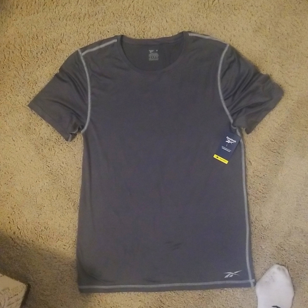 Reebok men's work out shirt.   Size Medium.  Super soft high performance fabric.